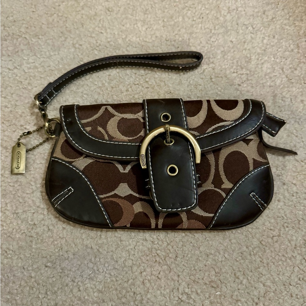 Authentic Brown and tan COACH wristlet. Gently used condition.